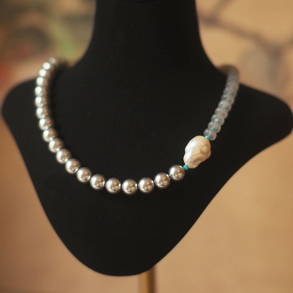 Elegant Silver Pearl Necklace with Skull Accent